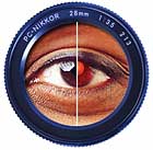 Red-Eye: Most image editors get rid of unsightly red-eye either by stamping a hard, black spot over the unfortunate subject's pupil or by desaturating the offensive red.